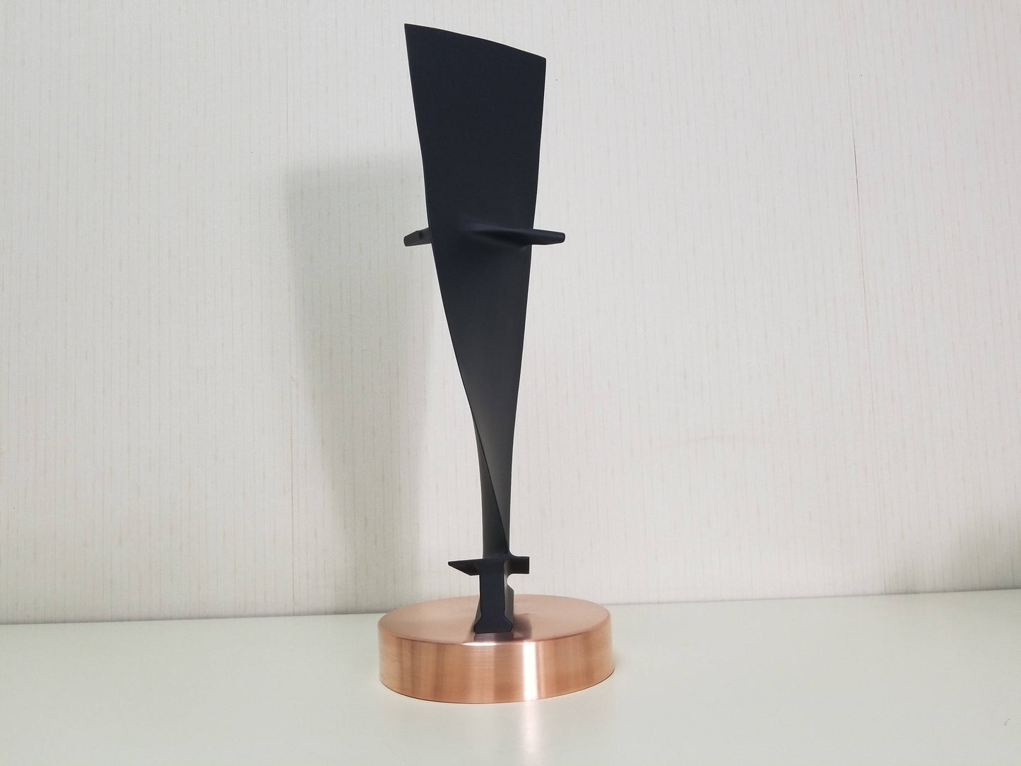 Carbon Black and Copper Pratt & Whitney JT8D stage 1 jet engine blade on a stand.